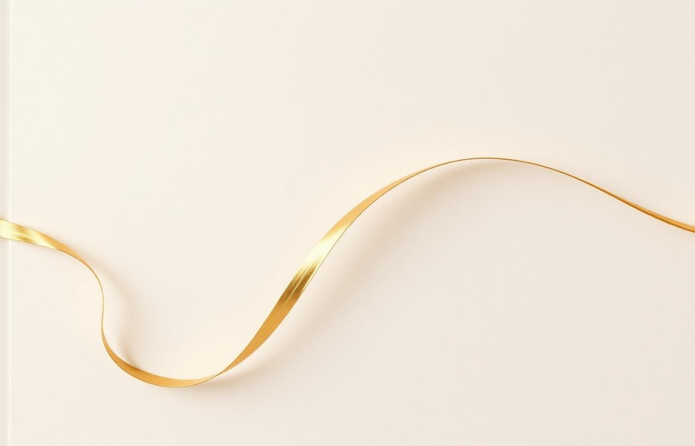 A single gold ribbon curving across an ivory surface